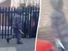 Chilling footage shows hooded man walking along street with huge knife in hand
