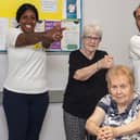 Practitioners Gellian and Hasan supporting people with Parkinson’s