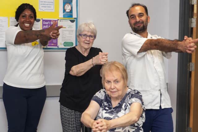 Practitioners Gellian and Hasan supporting people with Parkinson’s