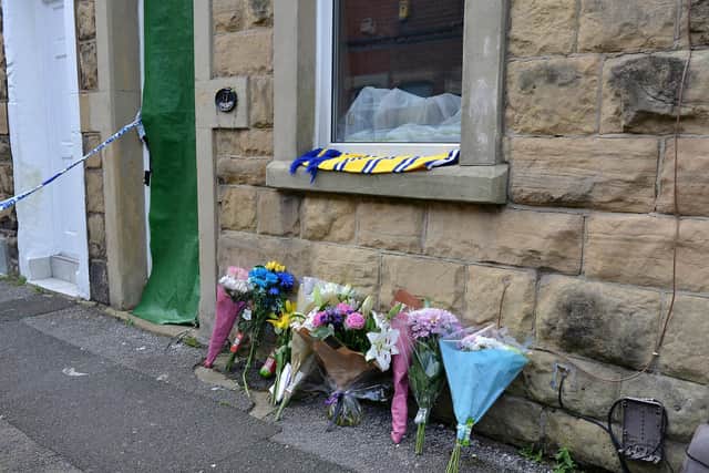 Scene of fatal stabbing on Gladstone Street, Mansfield , flowers lest at the scene.