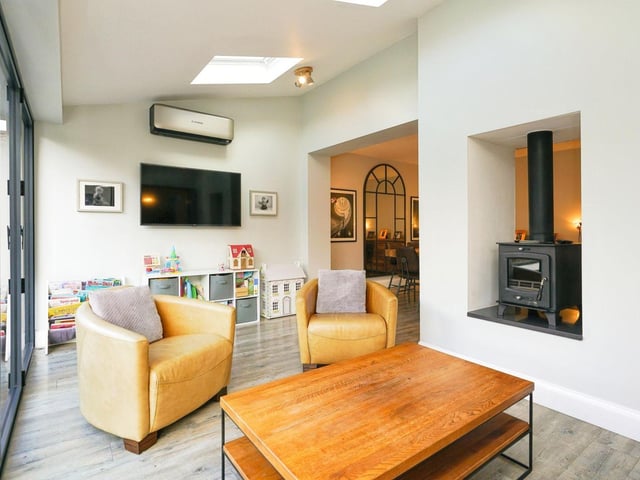 The current owners have created a stunning open plan living space. The living/dining/family room has a feature fireplace with dual aspect log burner.