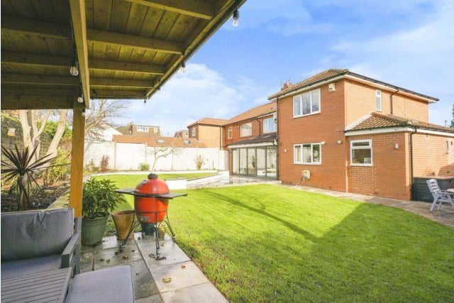 To the rear is a generous private enclosed garden which is lawned and has a large patio area and mature raised borders
