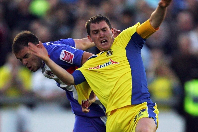 Neil Kilkenny tussles with Carlisle United's Grant Smith.