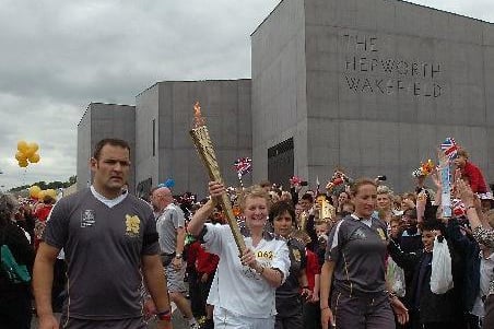 The Olympic torch procession passes The Hepworth
