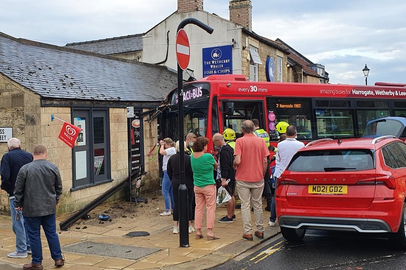 A bus has ploughed into a shop front and narrowly missed Wetherby Whaler Fish and Chip shop by inches tonight.