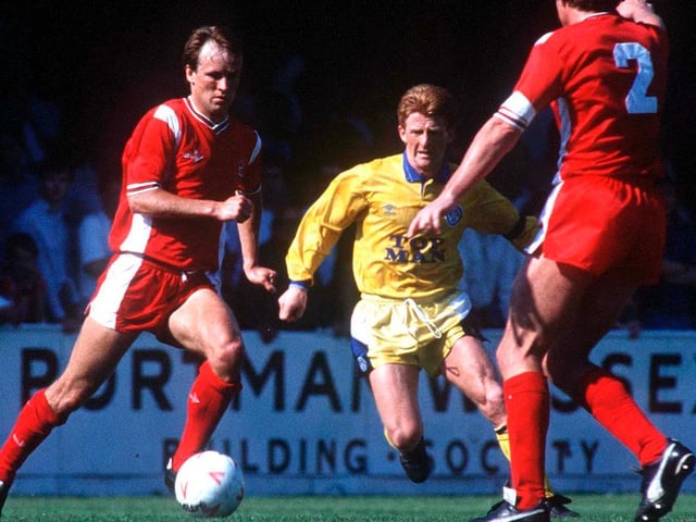 Gordon Strachan finds a way through the Bournemouth midfield.