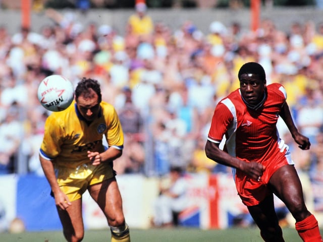 Mel Sterland chases down the ball des.pite the attentions of Bournemouth's Trevor Aylott
