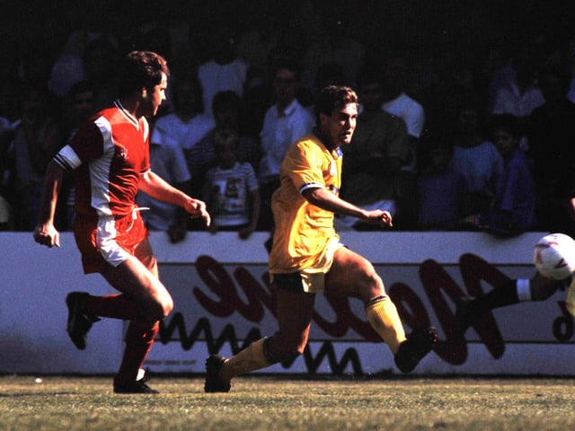 Carl Shutt gets the better of his marker to cross the ball.