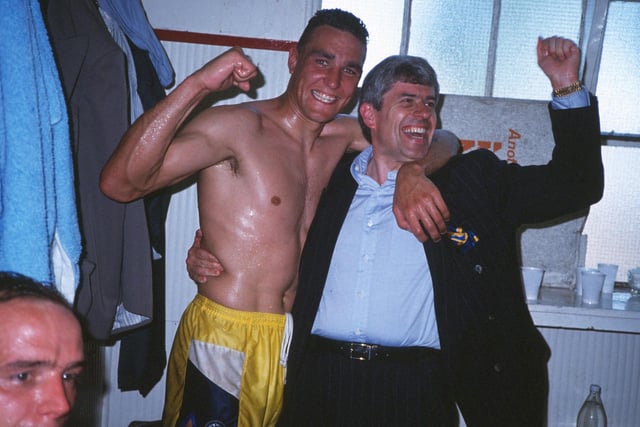 Vinnie Jones celebrates in the dressing room with Peter Ridsdale at full-time.