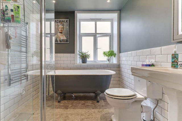 A deep, free standing bath tub is a feature of this bathroom.