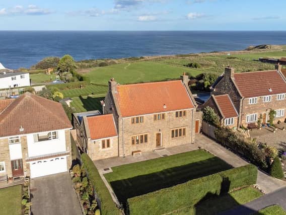The house in its enviable position overlooking the sea.