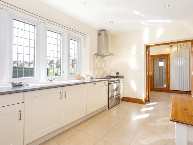 White units within the fitted dining kitchen.