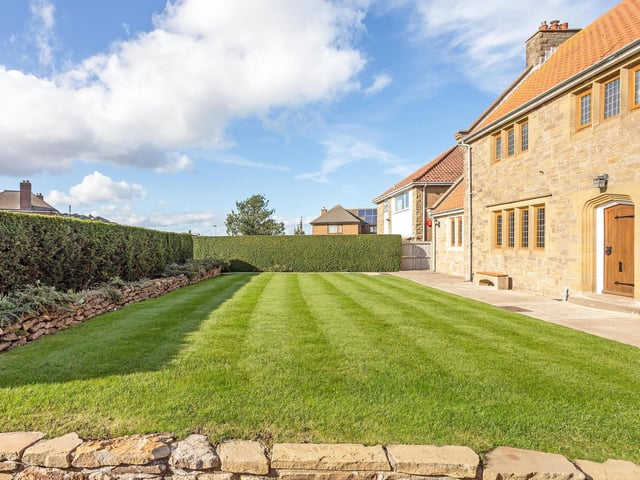 Planted borders around a garden area.