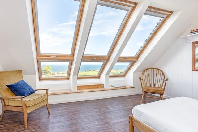 This bedroom of character looks out over the sea.