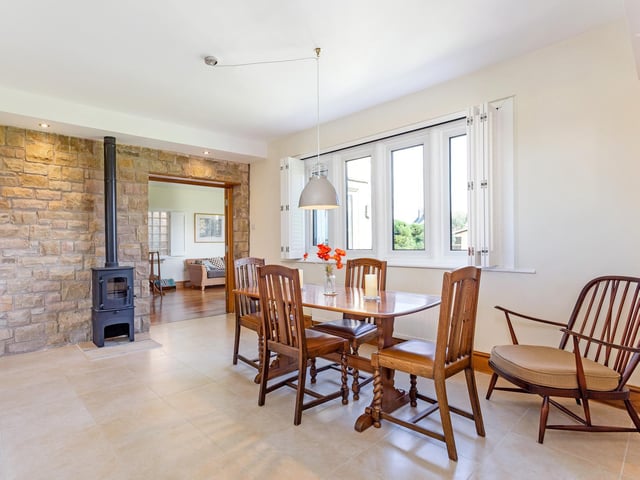 An exposed stone wall adds character to this room.