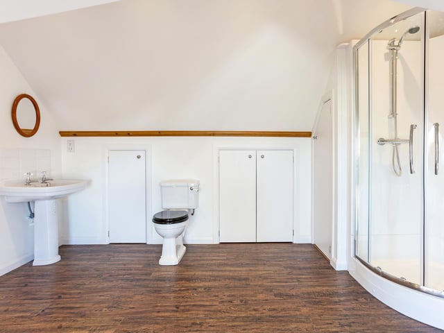 A large shower cubicle forms part of this bathroom suite.