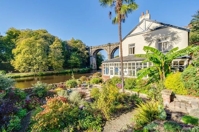 The house comes with beautifully tended gardens and a large conservatory.