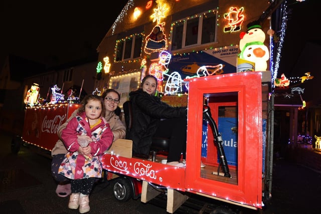 The display this year is featuring Dean’s version of the Coca Cola Christmas waggon, which he has built himself, plus singing carol singers and scores of Santas.

Pictured are Sarah Thurgur with Miley, three, and Alicia,11, enjoying the display