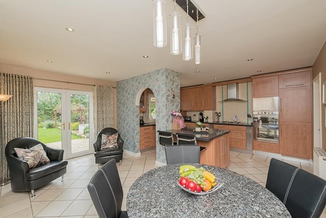 The stylish kitchen with dining area opens out to the garden.