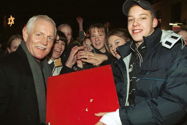 Emmerdale actor Chris Chittell (left) and Leeds United striker Alan Smith press the plunger to switch-on Rothwell Christmas lights in December 1999.