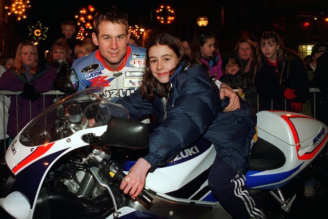 Motorcycle racer Jamie Whitham is pictured with Stella O'Sullivan after the pair switch on the Christmas lights in Dewsbury in December 1997.