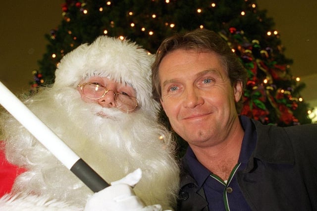 Brookside actor Steven Pinder, who plays Max Farnham, joined Santa Claus at the White Rose Centre to switch on their Christmas lights in November 1997.
