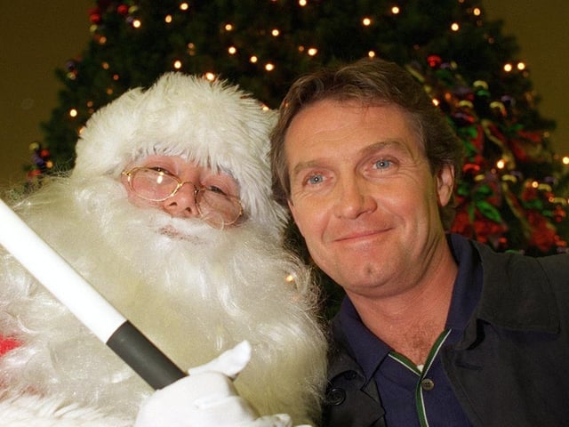 Brookside actor Steven Pinder, who plays Max Farnham, joined Santa Claus at the White Rose Centre to switch on their Christmas lights in November 1997.