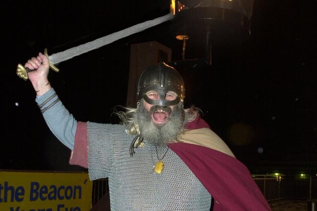 Blackpool's New Year's Eve beacon was lit by Snorri the Viking warrior in 2001
The Norseman celebrates the flames.