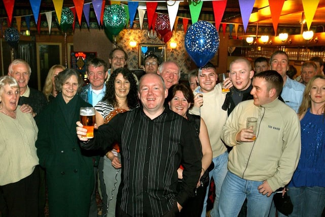 Landlord Maurice Murray (centre) and friends, at his late New Year's Eve party, at the Rossall Tavern, Fleetwood, 2004