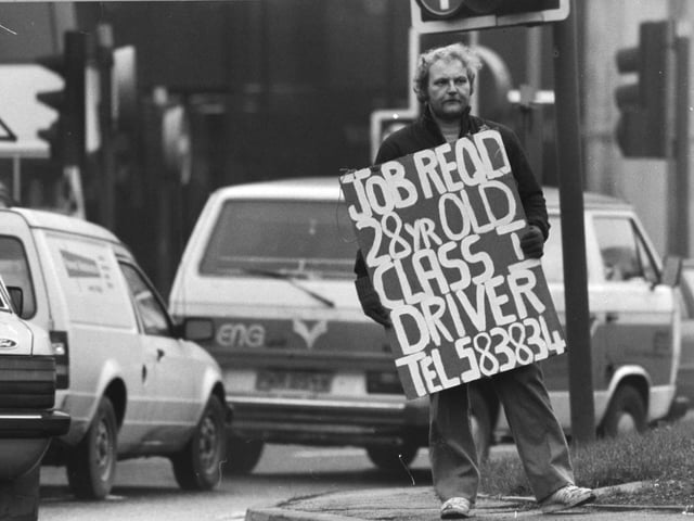 John Addock advertises for a job at the Wellington Street traffic junction in the city centre.