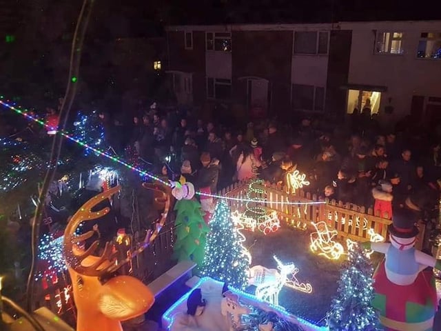 Crowds flock to Heman's Avenue to enjoy the display.