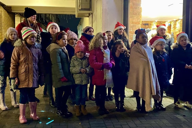 The choir from Belswains Primary School turned on the Christmas lights in Bennetts End