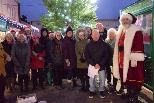 Gobstoppers Glee, who provided the festive music, and Santa at Stoneycroft shops, Warners End