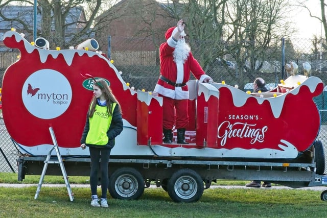 Santa Claus waving at the crowds in Leamington