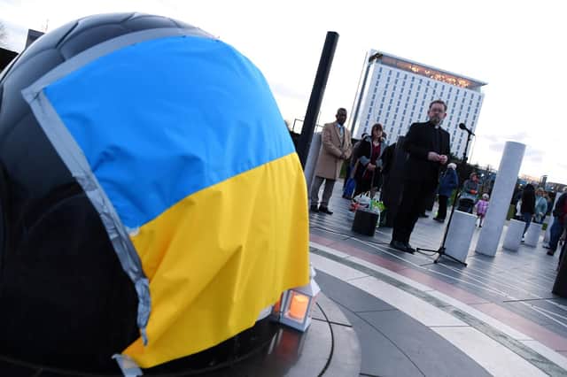 Residents were invited to 'stand in solidarity' with the people of Ukraine and light candles