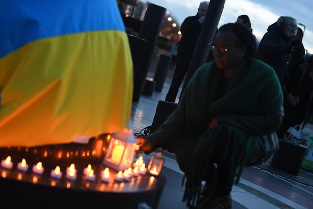 People were invited to light candles and place them under the Ukraine flag