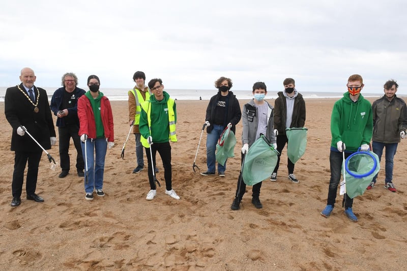 Mayor Coun Trevor Burnham, Deputy Mayor Coun Billy Brookes, volunteers  and climate conscious students litter picking on Skegness beach.