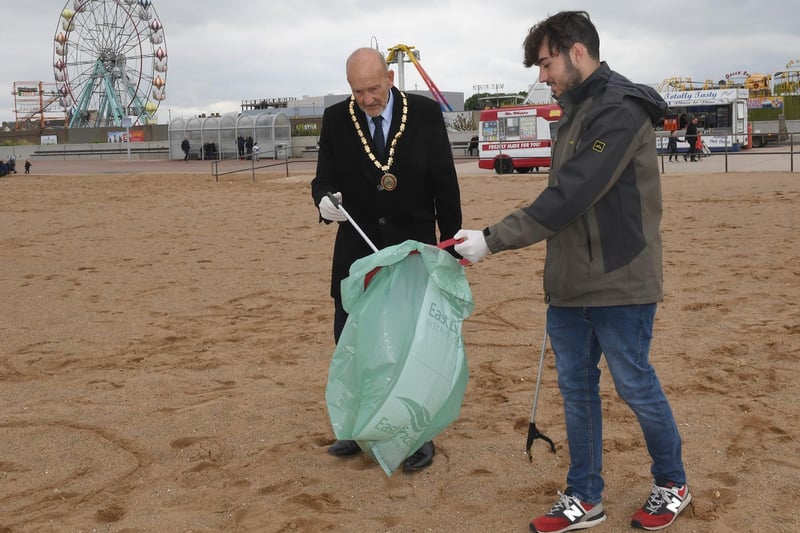 Mayor of Skegness Coun Trevor Burnham and Deputy Mayor Coun Billy Brookes taking part in the Million Mile Clean on the beach.