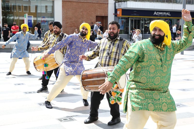 The Dancing Maharajas brought a festival feel to the area despite the rain and wowed standers by with their interactive and vibrantly dynamic performances
