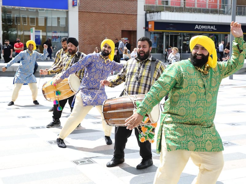 The Dancing Maharajas brought a festival feel to the area despite the rain and wowed standers by with their interactive and vibrantly dynamic performances