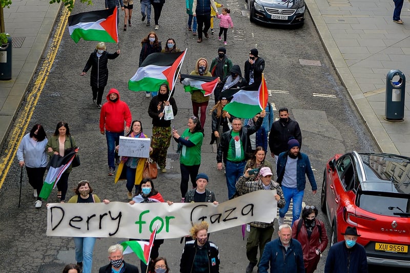 Protesters make their along Shipquay Street, on Saturday afternoon last, during a rally, organised by the Derry IPSC, in solidarity with the people of Palestine. Photo: George Sweeney. DER2119GS - 016