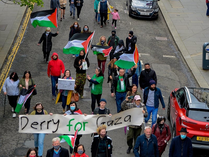Protesters make their along Shipquay Street, on Saturday afternoon last, during a rally, organised by the Derry IPSC, in solidarity with the people of Palestine. Photo: George Sweeney. DER2119GS - 016