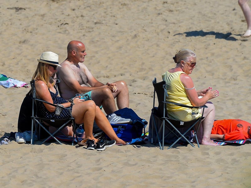 Sun seekers relax on Shrove beach during the recent mini heat wave in Inishowen. DER2129GS - 072