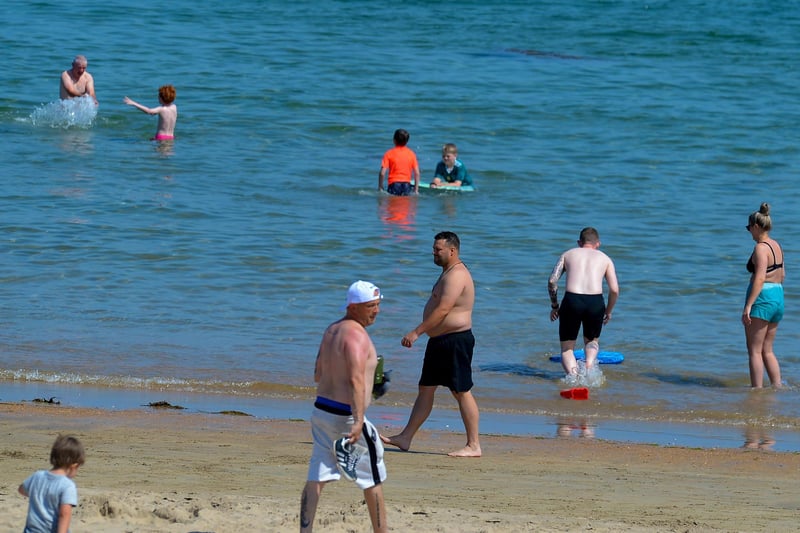 Bathers on Shroove beach, Inishowen, during the recent mini heatwave. DER2129GS - 063
