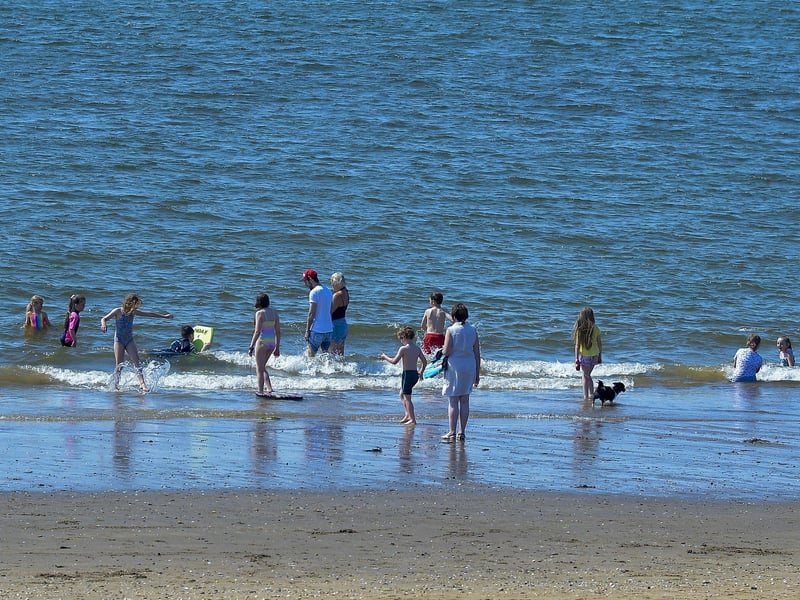 Bathers enjoy the sunshine and the soaring temperatures, at Lady’s Bay on Buncrana’s Shore Front, on Saturday afternoon last. Photo: George Sweeney. DER2128GS – 044