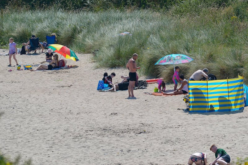 People enjoy the sunshine on Shroove beach, Inishowen, during the recent mini heatwave. DER2129GS - 064