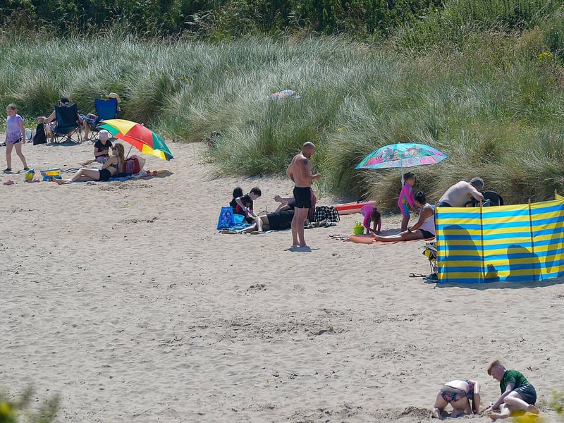 People enjoy the sunshine on Shroove beach, Inishowen, during the recent mini heatwave. DER2129GS - 064
