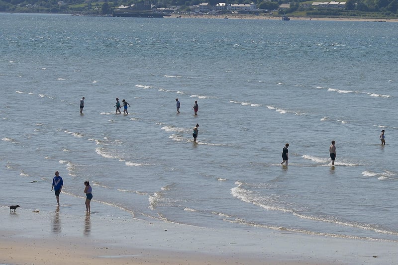 Dippers enjoy the sunshine and water at Lisfannon beach, on Saturday afternoon last, during the mini – heatwave. Photo: George Sweeney. DER2128GS – 047