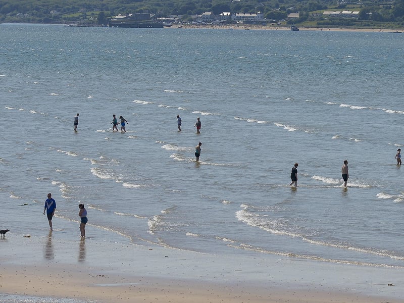 Dippers enjoy the sunshine and water at Lisfannon beach, on Saturday afternoon last, during the mini – heatwave. Photo: George Sweeney. DER2128GS – 047