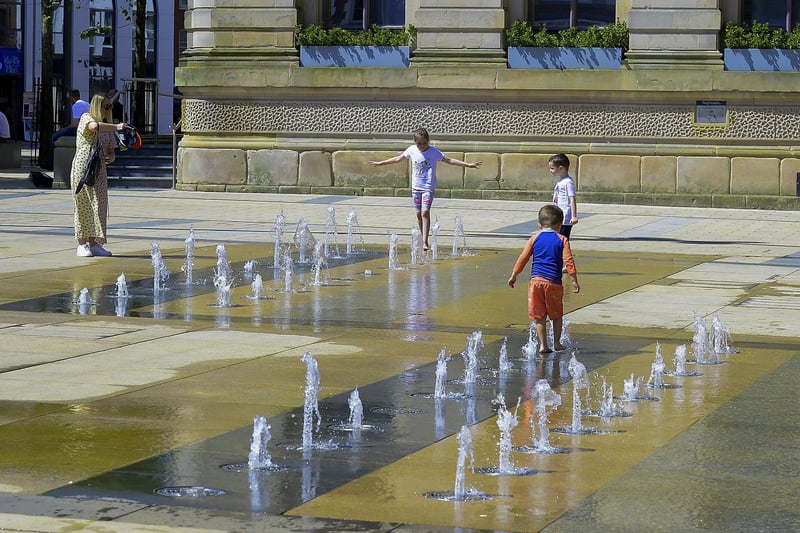 The water fountains in Guildhall Square were popular with children during the warm and sunny weather over the weekend. Photo: George Sweeney. DER2128GS – 052